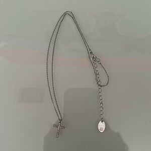 silver cross necklace.
